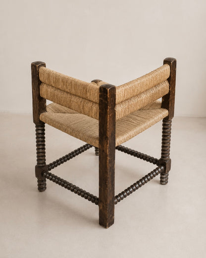 Fauteuil d'angle à piétement tourné en chapelet, dans le goût de Charles Dudouyt — France, circa 1940