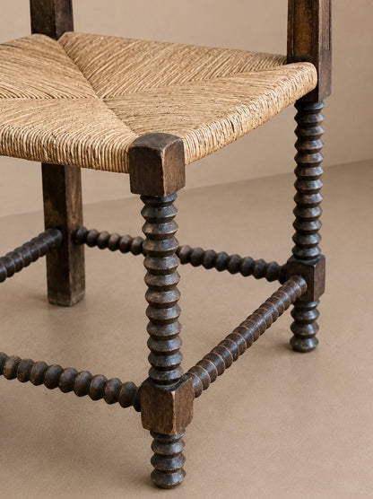 Fauteuil d'angle à piétement tourné en chapelet, dans le goût de Charles Dudouyt — France, circa 1940