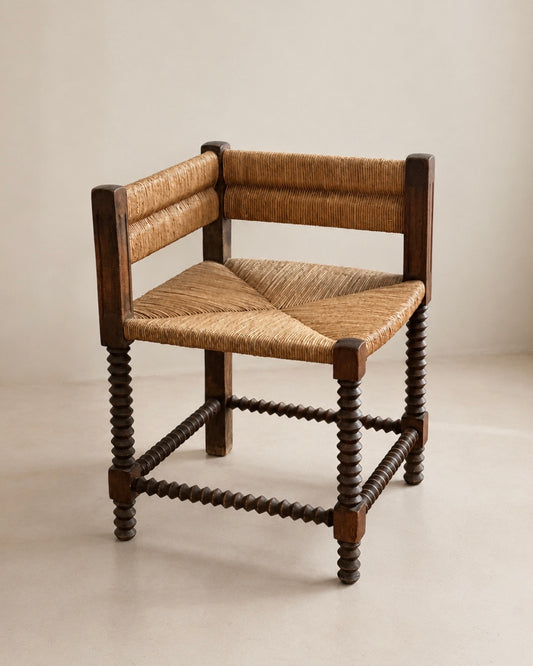 Fauteuil d'angle à piétement tourné en chapelet, dans le goût de Charles Dudouyt — France, circa 1940